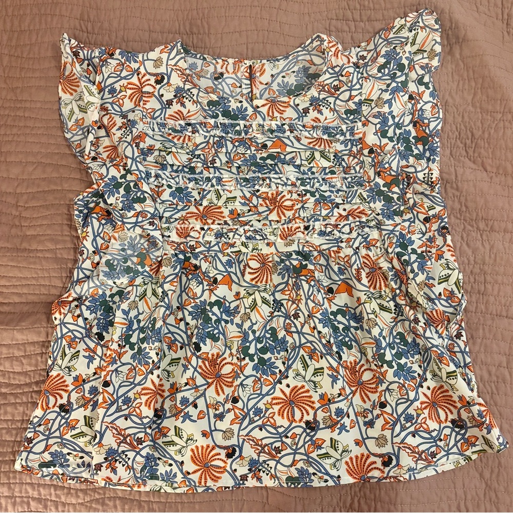 Sleeveless Floral Ruffle Smocked Blouse - White with Blue & Orange Floral